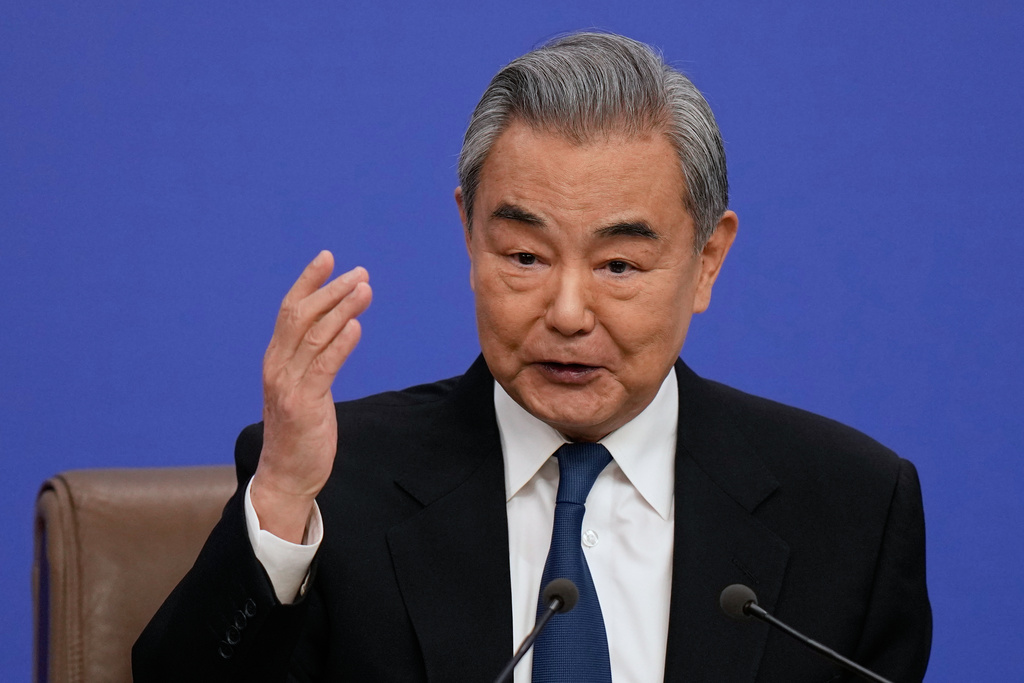 Chinese Foreign Minister Wang Yi speaks during a press conference on the sideline of the National People's Congress (NPC) at the media center, in Beijing, Sunday, March 8, 2026. (AP Photo/Andy Wong)