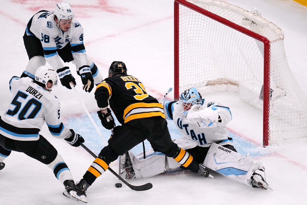 Utah Mammoth goaltender Vitek Vanecek (41) makes a save on a shot by Boston Bruins center Morgan Geekie (39) during the third period of an NHL hockey game, Tuesday, Dec. 16, 2025, in Boston. (AP Photo/Charles Krupa)