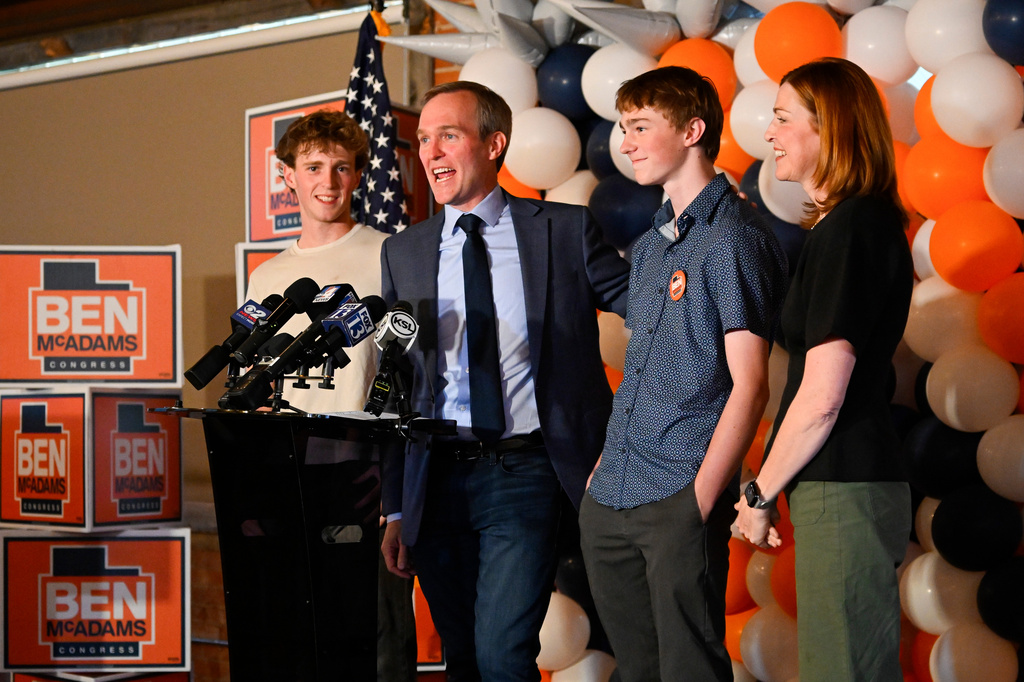 Democratic congressional candidate Ben McAdams speaks between family members James, Isaac and Julie during a watch party for Utah's primary election on Tuesday, June 23, 2026, in Salt Lake City. (AP Photo/Alex Goodlett)
