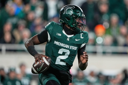 Michigan State quarterback Aidan Chiles runs with the ball during the first half of an NCAA college football game against Michigan, Saturday, Oct. 25, 2025, in East Lansing, Mich. (AP Photo/Ryan Sun) Michigan State quarterback Aidan Chiles runs with the ball during the first half of an NCAA college football game against Michigan, Saturday, Oct. 25, 2025, in East Lansing, Mich. (AP Photo/Ryan Sun)