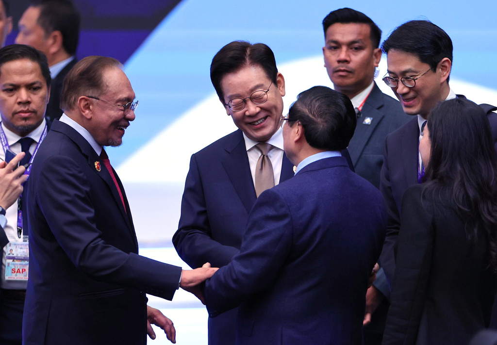 Chairman of the Association of Southeast Asian Nations (ASEAN) and Prime Minister of Malaysia Anwar Ibrahim, second left, South Korea's President Lee Jae Myung, center, and Vietnam's Prime Minister Pham Minh Chinh speak during the 26th ASEAN – Republic of Korea (ROK) Summit, as part of the 47th Association of Southeast Asian Nations (ASEAN) summit in Kuala Lumpur, Malaysia, Monday, Oct. 27, 2025. (Hasnoor Hussain/Pool Photo via AP)