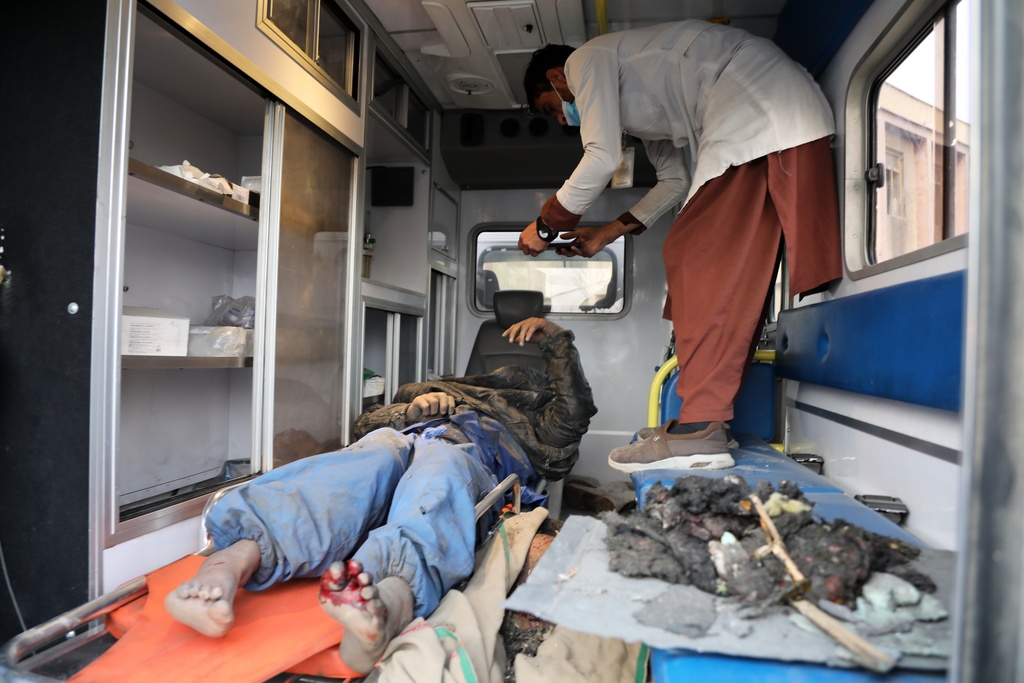 A survivor is treated in an ambulance at the site of a late-Monday airstrike at a drug rehabilitation hospital in Kabul, Afghanistan, Tuesday, March 17, 2026. (AP Photo/Siddiqullah Alizai)