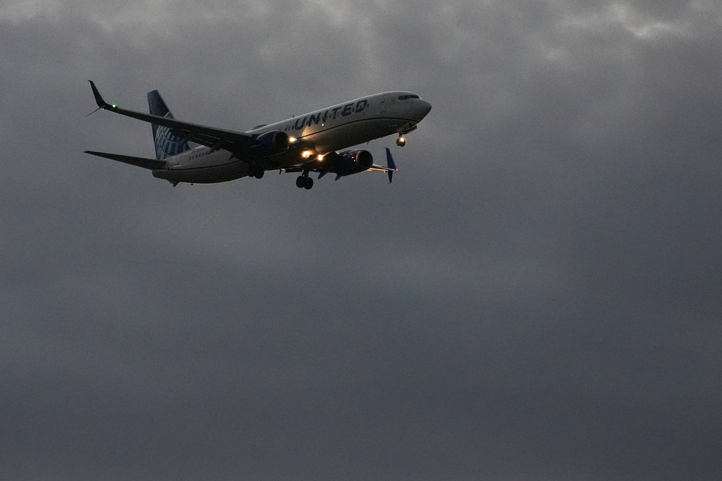 An United Airlines flight arrives at O'Hare International Airport in Chicago, Monday, Nov. 3, 2025. (AP Photo/Nam Y. Huh)