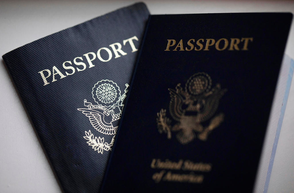 FILE - U.S. passports are arranged for a photograph in Tigard, Ore., Dec. 11, 2021. (AP Photo/Jenny Kane, File)