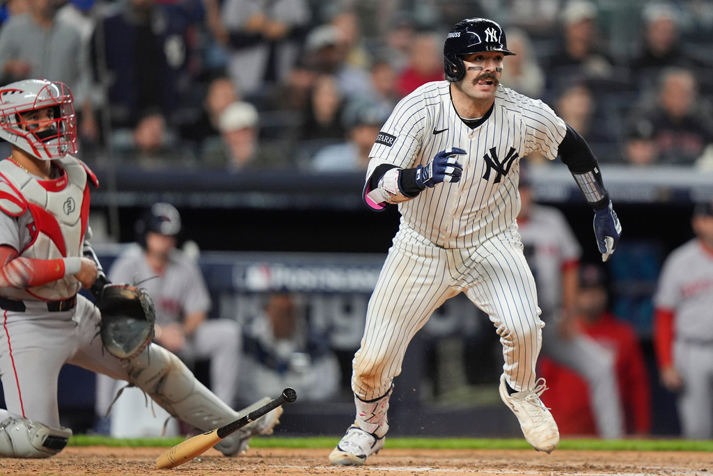 New York Yankees Austin Wells makes his way to first base after connecting for an RBI single to right field that allowed Jazz Chisholm Jr. to score the go-ahead run against the Boston Red Sox during the eighth inning of Game 2 of an American League wild-card baseball playoff series, Wednesday, Oct. 1, 2025, in New York. (AP Photo/Frank Franklin II)