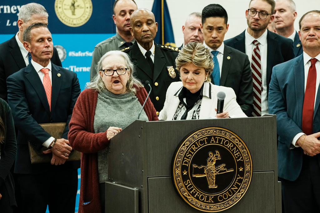 Elizabeth Baczkiel, mother of victim Jessica Taylor, speaks during a news conference after Rex Heuermann, accused in Long Island's Gilgo Beach serial killings, pleaded guilty on Wednesday, April 8, 2026, at Suffolk County Police Academy Gymnasium in Brentwood, N.Y. At center right is attorney Gloria Allred. (AP Photo/Eduardo Munoz Alvarez)