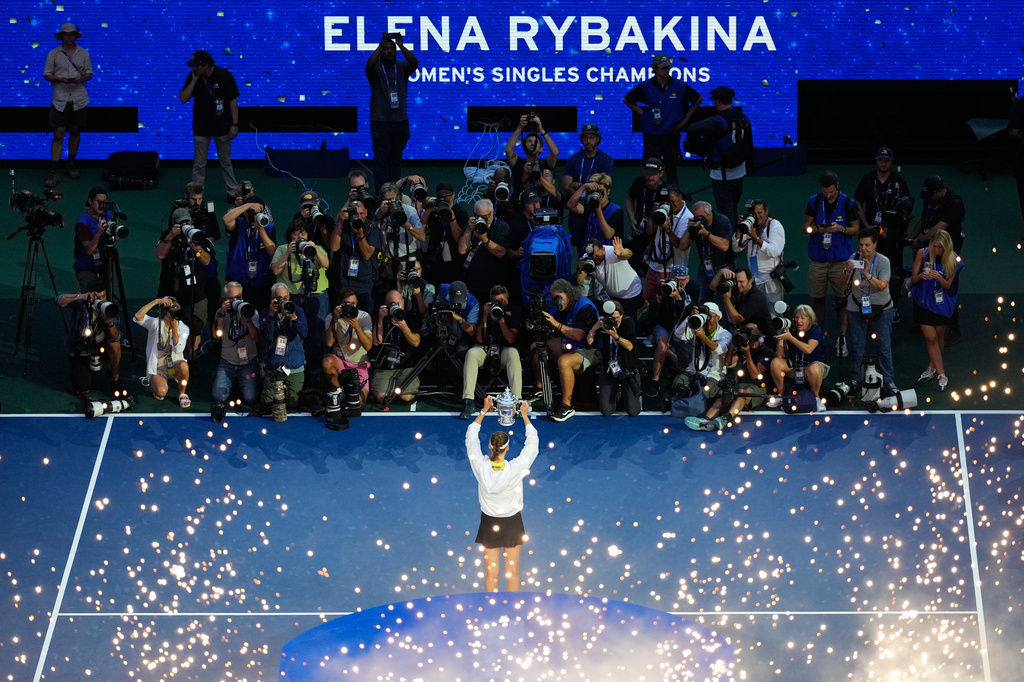 Elena Rybakina, of Kazakhstan, holds the trophy after she won the women's singles final of the U.S. Open tennis championships against Aryna Sabalenka, of Belarus, Saturday, Sept. 12, 2026, in New York. (AP Photo/Yuki Iwamura)