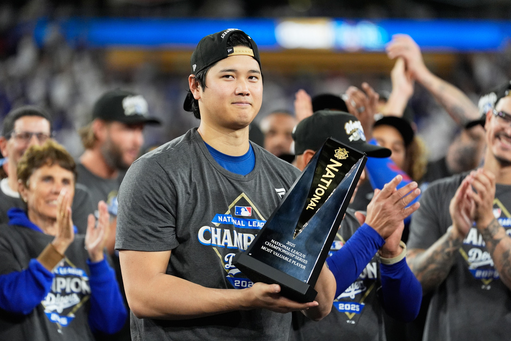 Los Angeles Dodgers pitcher Shohei Ohtani celebrates their win against the Milwaukee Brewers in baseball's National League Championship Series, Friday, Oct. 17, 2025, in Los Angeles.(AP Photo/Brynn Anderson)