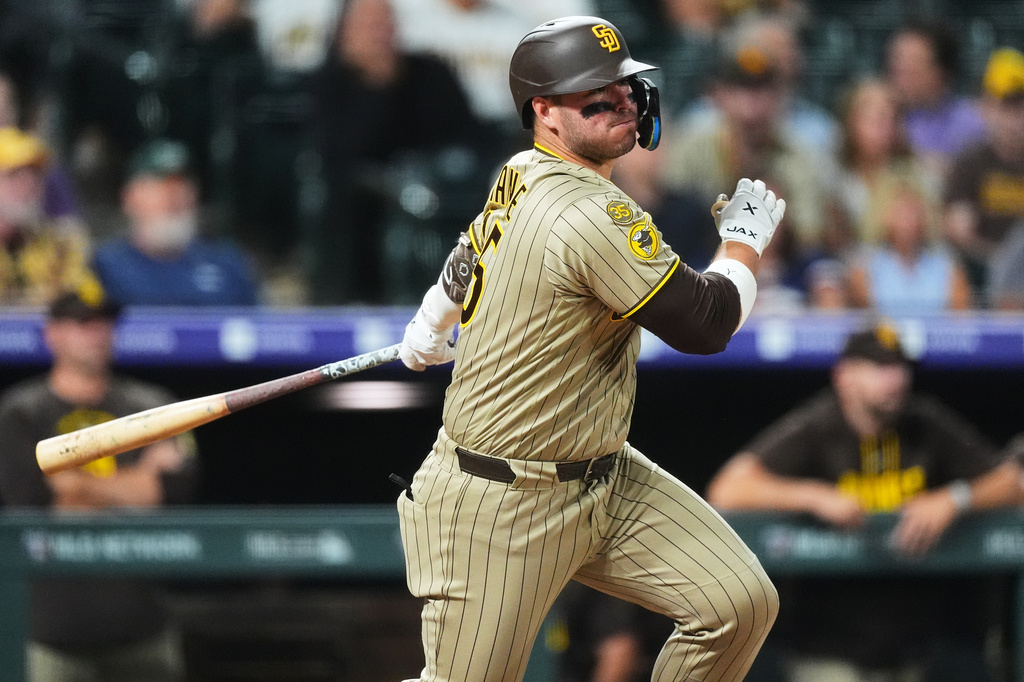 San Diego Padres' Ty France watches his RBI single off Colorado Rockies relief pitcher Mark Manfredi in the seventh inning of a baseball game Monday, Sept. 14, 2026, in Denver. (AP Photo/David Zalubowski)