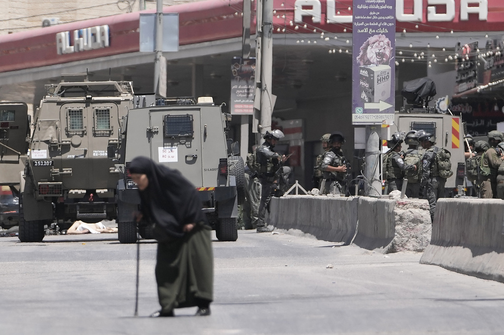 Israeli border police officers operate in the West Bank refugee camp of Qalandia, after Israeli forces shot and killed a suspected militant who opened fire on troops Monday, May 11, 2026. (AP Photo/Mahmoud Illean)