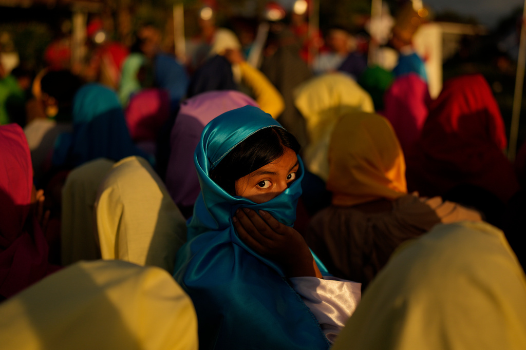 A devotee dressed as a townsperson takes part in a Way of the Cross reenactment in Arraijan, Panama, Good Friday, April 3, 2026. (AP Photo/Matias Delacroix)