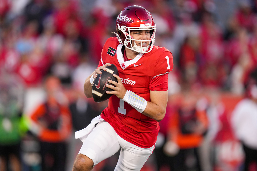 Houston quarterback Conner Weigman scrambles against Oklahoma State during the first half of an NCAA college football game Saturday, Oct. 17, 2026, in Houston. (AP Photo/Eric Christian Smith)