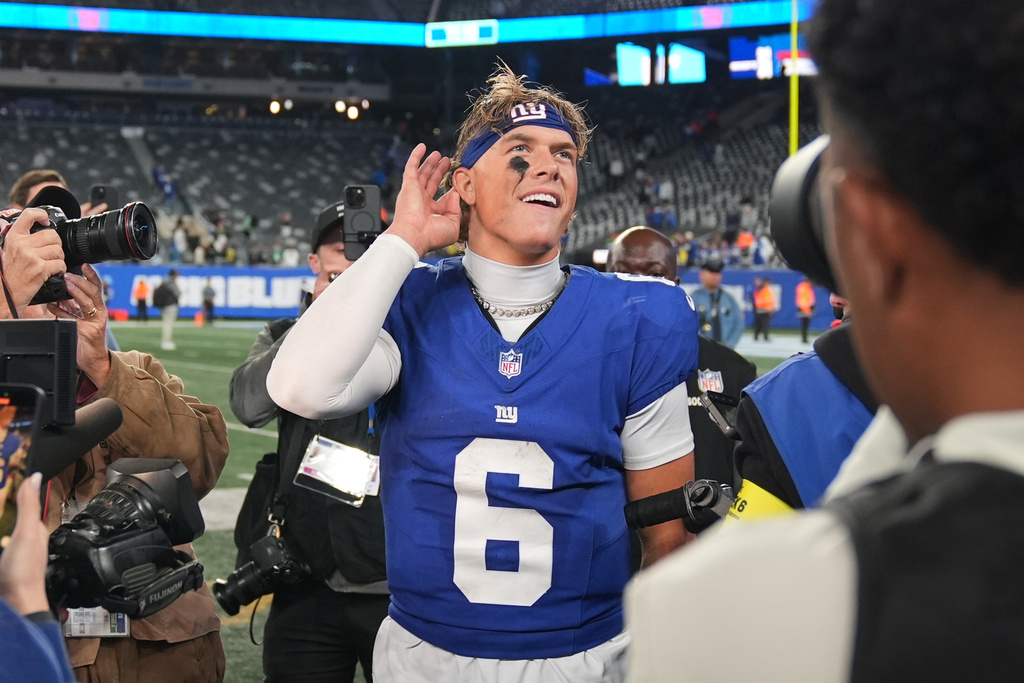 New York Giants' Jaxson Dart reacts after an NFL football game against the Philadelphia Eagles Thursday, Oct. 9, 2025, in East Rutherford, N.J. (AP Photo/Seth Wenig)