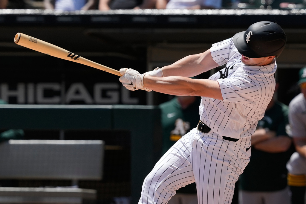 Chicago White Sox's Kyle Teel hits a two-run single during the first inning of a baseball game against the Athletics in Chicago, Sunday, July 12, 2026. (AP Photo/Nam Y. Huh)