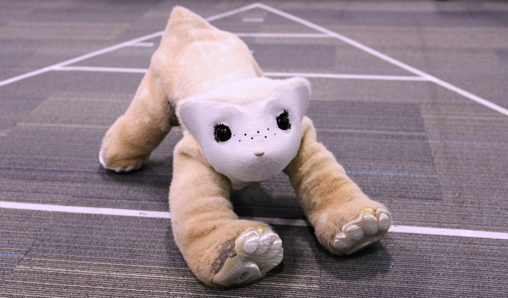 Familiar, an AI pet robot, interacts during a demonstration at the Massachusetts-based startup Familiar Machines & Magic, Wednesday, April 29, 2026, in Woburn, Mass. (AP Photo/Charles Krupa)