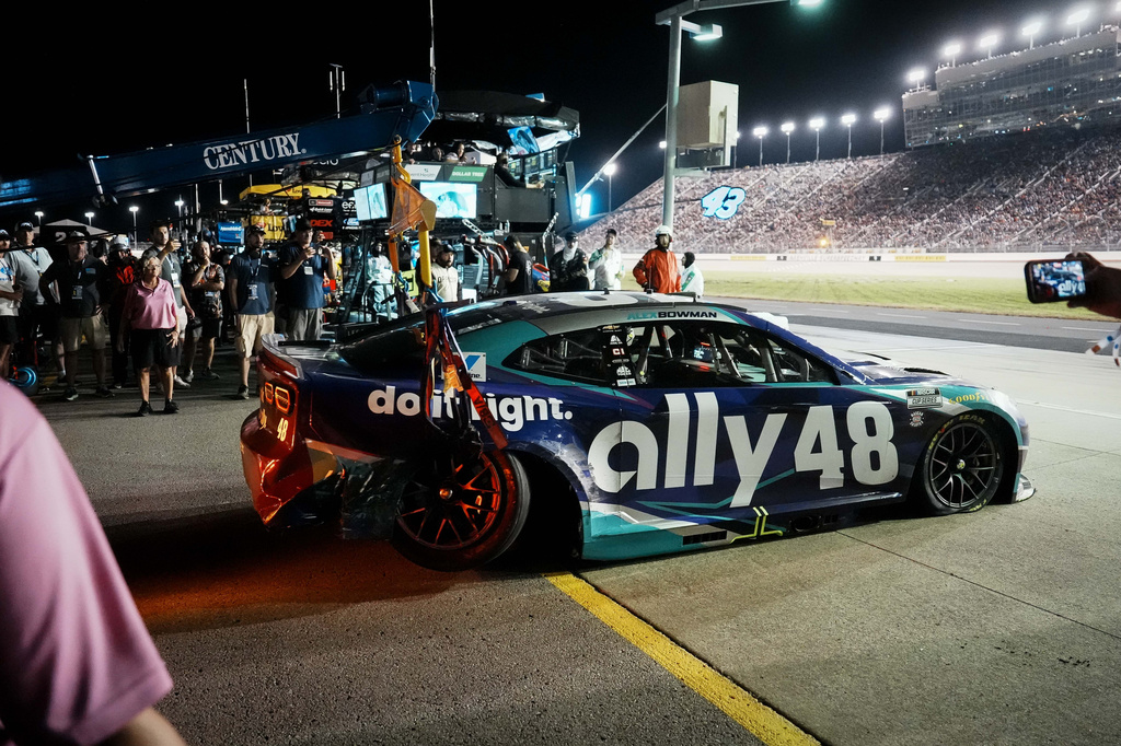 Alex Bowman is towed off the track after a collision during a NASCAR Cup Series auto race, Sunday, May 31, 2026, in Lebanon, Tenn. (AP Photo/Camden Hall)