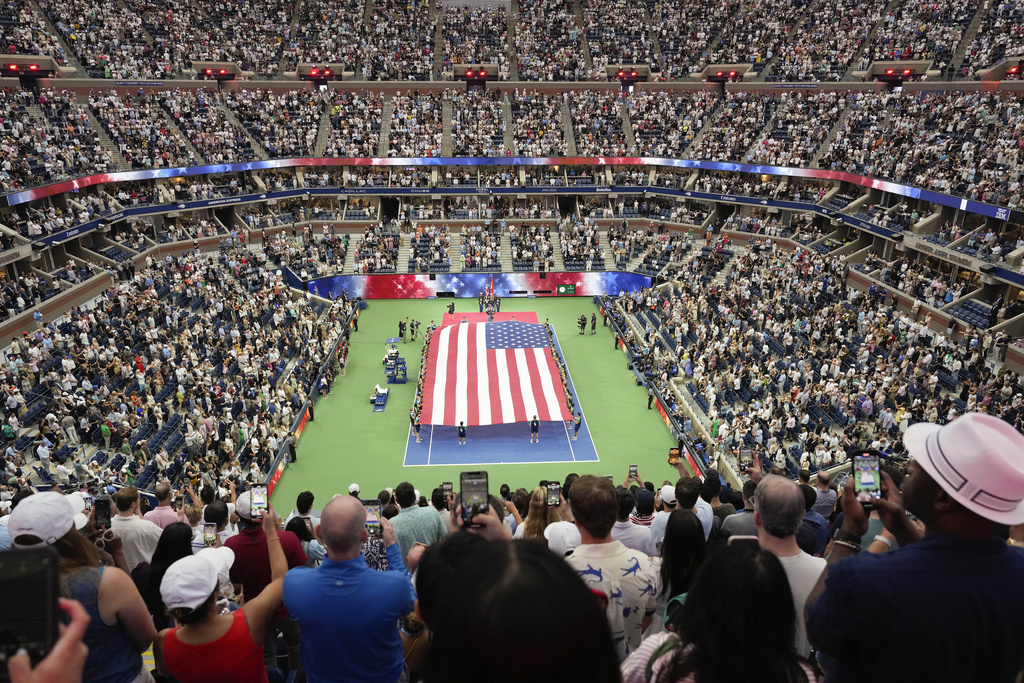 Spectators stand for the presentation of colors before the women's singles final between Aryna Sabalenka, of Belarus, and Aryna Sabalenka, of Belarus, at the U.S. Open tennis championships, Saturday, Sept. 6, 2025, in New York. (AP Photo/Seth Wenig)
