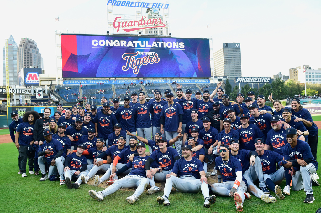 Detroit Tigers players pose for a photo after winning Game 3 of the American League Wild Card baseball playoff series against the Cleveland Guardians in Cleveland, Thursday, Oct. 2, 2025. (AP Photo/Phil Long)