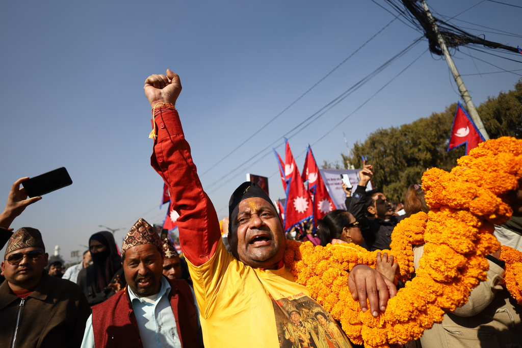 Supporters of Nepal's former royal family participate in a rally demanding the restoration of the monarchy as they mark the birth anniversary of the 18th century king Prithivi Narayan Shah, founder of the Shah dynasty, in Katmandu, Nepal, Sunday, Jan. 11, 2026. (AP Photo/Subash Shrestha)