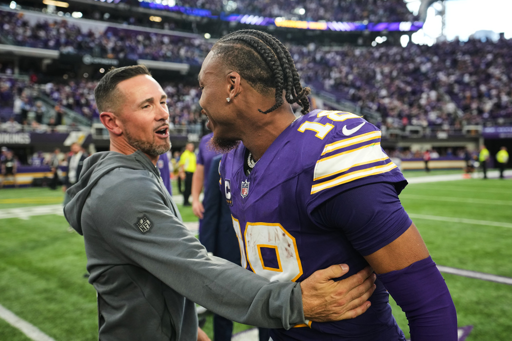 Green Bay Packers head coach Matt LaFleur, left, and Minnesota Vikings wide receiver Justin Jefferson (18) greet each other after an NFL football game, Sunday, Sept. 13, 2026, in Minneapolis, Minn. (AP Photo/Abbie Parr)
