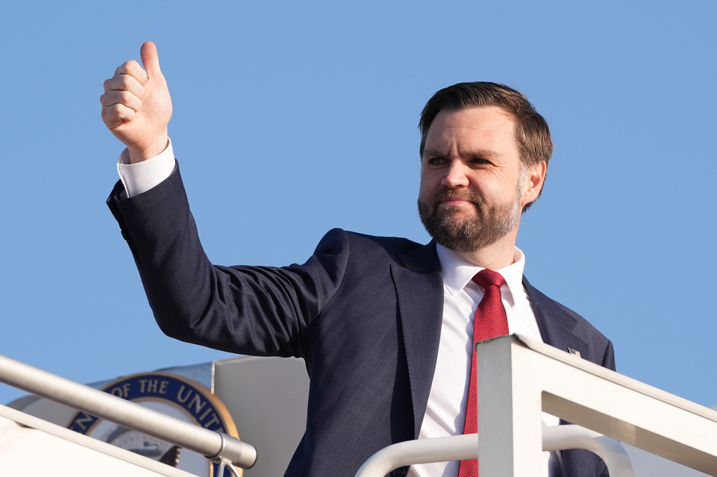 Vice President JD Vance gives a thumb up sign as he boards Air Force Two after attending talks on Iran in Islamabad, Pakistan, Sunday, April 12, 2026, . (AP Photo/Jacquelyn Martin, Pool)