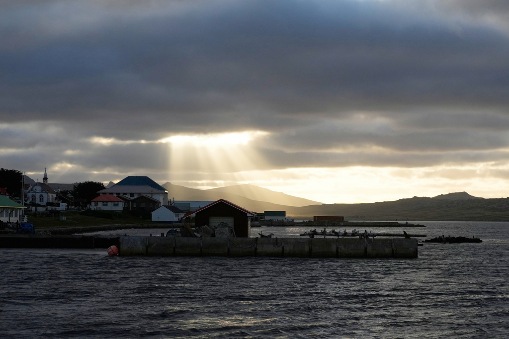 FILE - Sunlight breaks through the clouds over Stanley on the Falkland Islands, also known as Islas Malvinas, March 14, 2026. (AP Photo/Ricardo Mazalan, File)