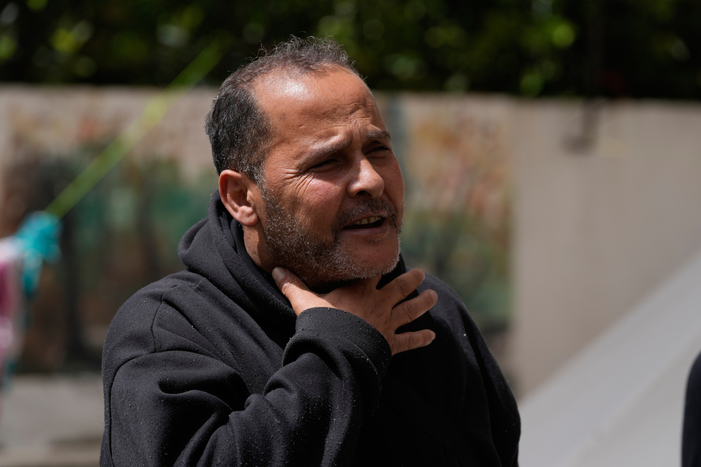 Ali al-Salim, who fled his southern hometown of Siddiqin for a school shelter in Haret Saida after an anonymous caller identifying himself as from the Israeli military urged him to flee, gestures during an interview with the Associated Press in the southern port city of Sidon, Lebanon, Tuesday, April 14, 2026. (AP Photo/Mohammed Zaatari)
