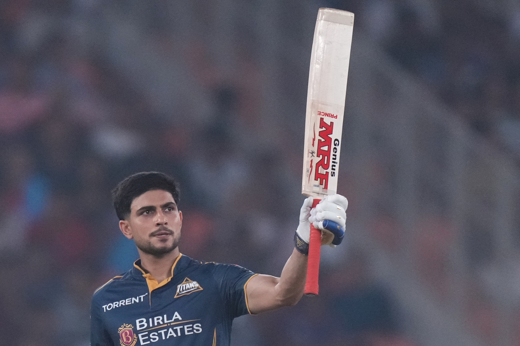 Gujarat Titans' captain Shubman Gill celebrates his fifty runs during the Indian Premier League cricket match between Gujarat Titans and Kolkata Knight Riders in Ahmedabad, India, Friday, April 17, 2026. (AP Photo/Ajit Solanki)