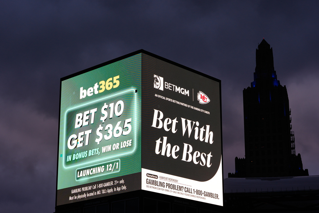 FILE - Advertisements for sports betting apps are seen in downtown Kansas City, Mo., Nov. 29, 2025. (AP Photo/Charlie Riedel, File)