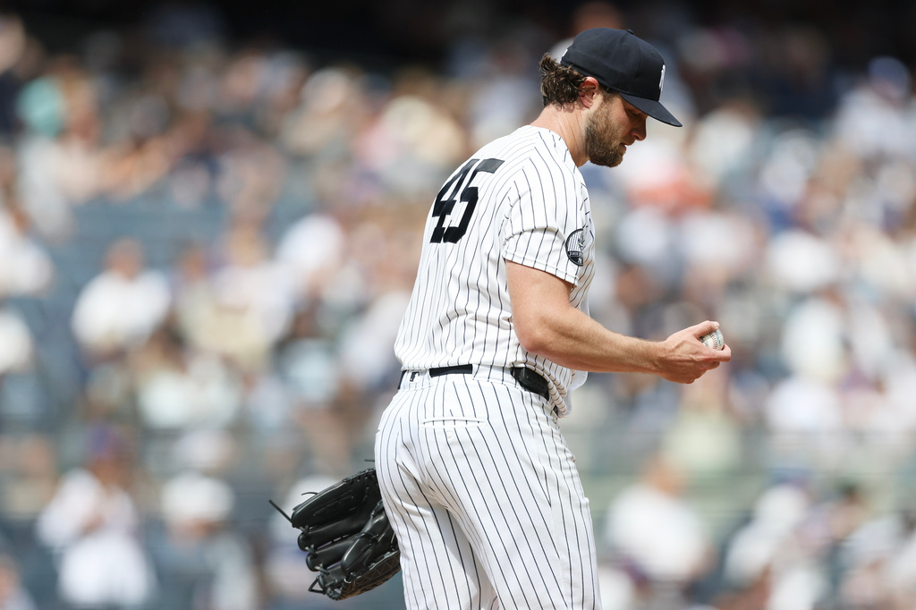 New York Yankees pitcher Gerrit Cole looks down after giving up a home run to New York Mets' Francisco Lindor during the first inning of a baseball game, Saturday, Sept. 12, 2026, in New York. (AP Photo/Heather Khalifa)