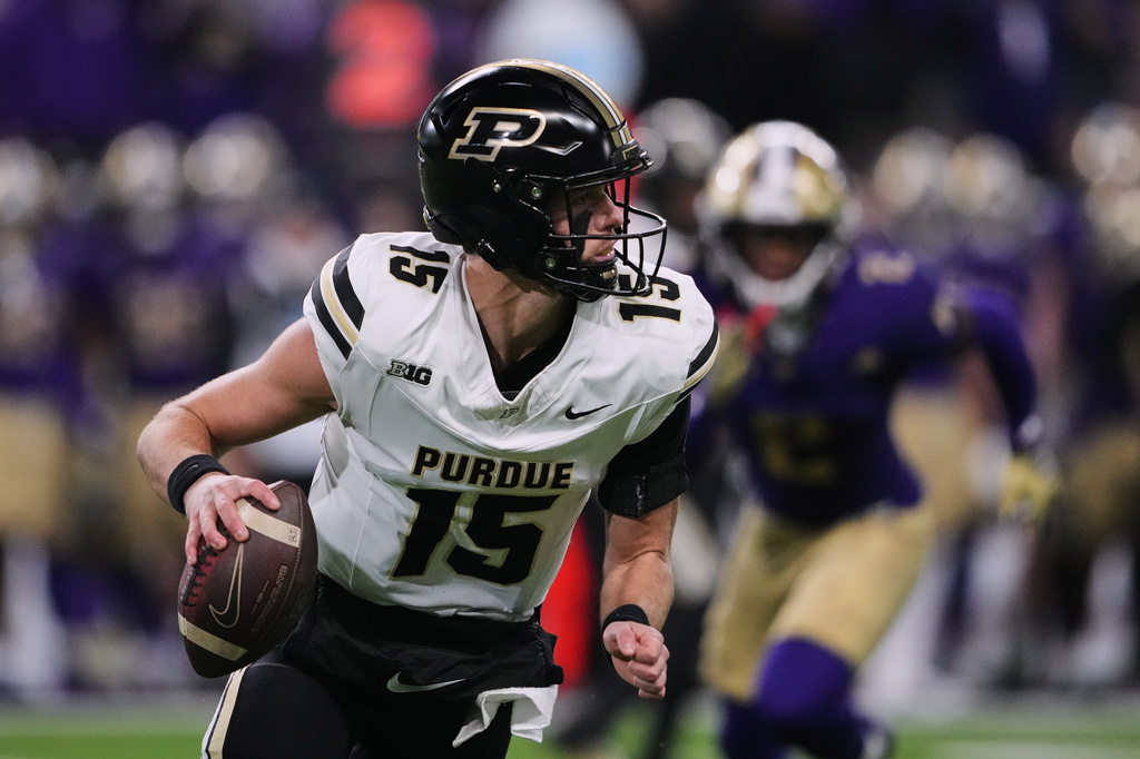 FILE - Purdue quarterback Ryan Browne (15) looks to throw against Washington during the first half of an NCAA college football game, Nov. 15, 2025, in Seattle. (AP Photo/Lindsey Wasson, File)
