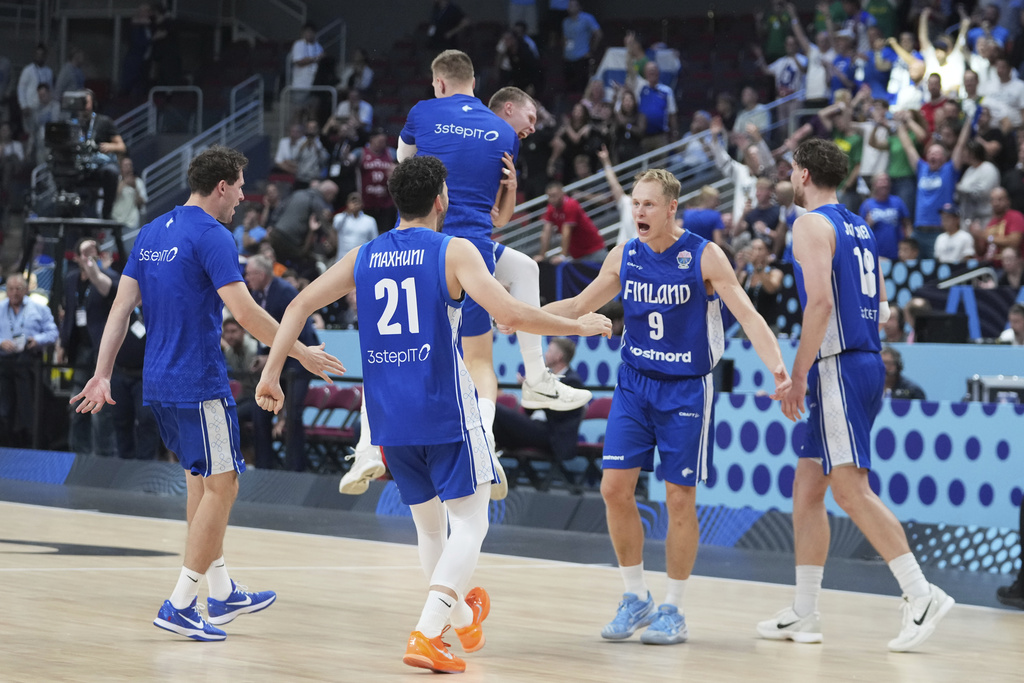 Finland players celebrate their victory after the Eurobasket, European Basketball Championship round of 16 match between Serbia and Finland at the Riga Arena in Riga, Latvia, Saturday, Sept. 6, 2025. (AP Photo/Sergei Grits)