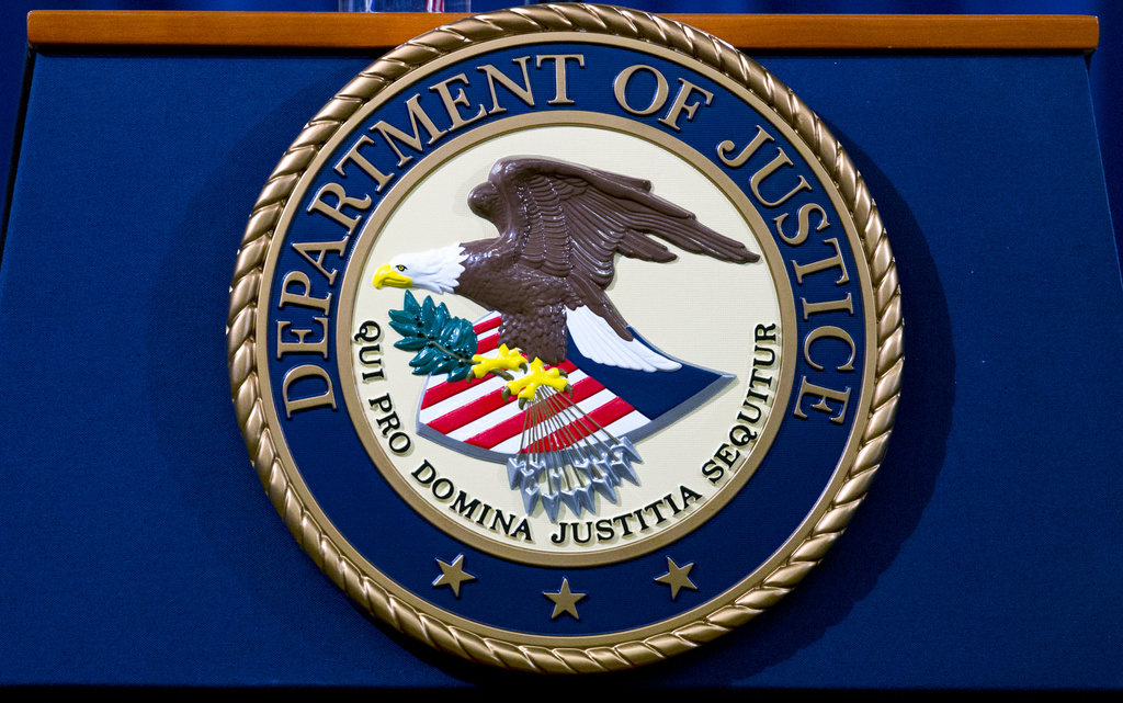 FILE - The Department of Justice seal is seen in Washington, Nov. 28, 2018. (AP Photo/Jose Luis Magana, File)