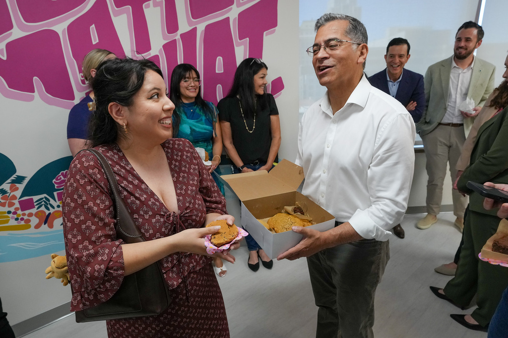 California Democratic gubernatorial candidate Xavier Becerra thanks Amy Perez for her support as he passes out cookies at the Planned Parenthood headquarters in Sacramento, Calif., Monday, June 1, 2026. (AP Photo/Rich Pedroncelli)