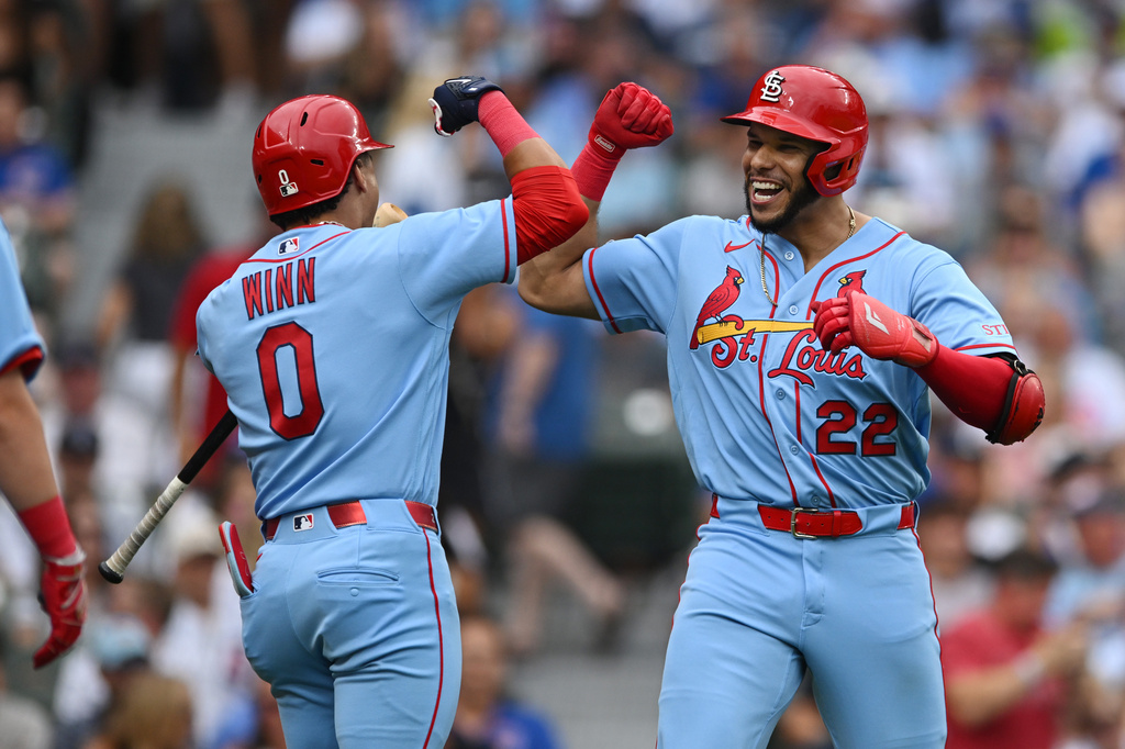 St. Louis Cardinals' Joshua Baez (22) celebrates with teammate Masyn Winn (0) after hitting a three-run home run during the first inning of a baseball game against the Chicago Cubs in Chicago, Saturday, Aug. 15, 2026. (AP Photo/Paul Beaty)