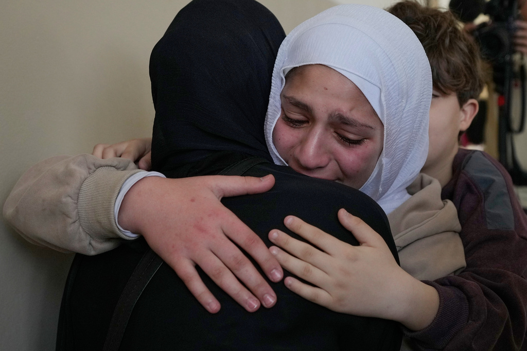 Relatives of Ghadir Baalbaki, 19, who was killed on Tuesday in an Israeli airstrike, mourn during her funeral in the southern port city of Tyre, Lebanon, Wednesday, April 15, 2026. (AP Photo/Hussein Malla)