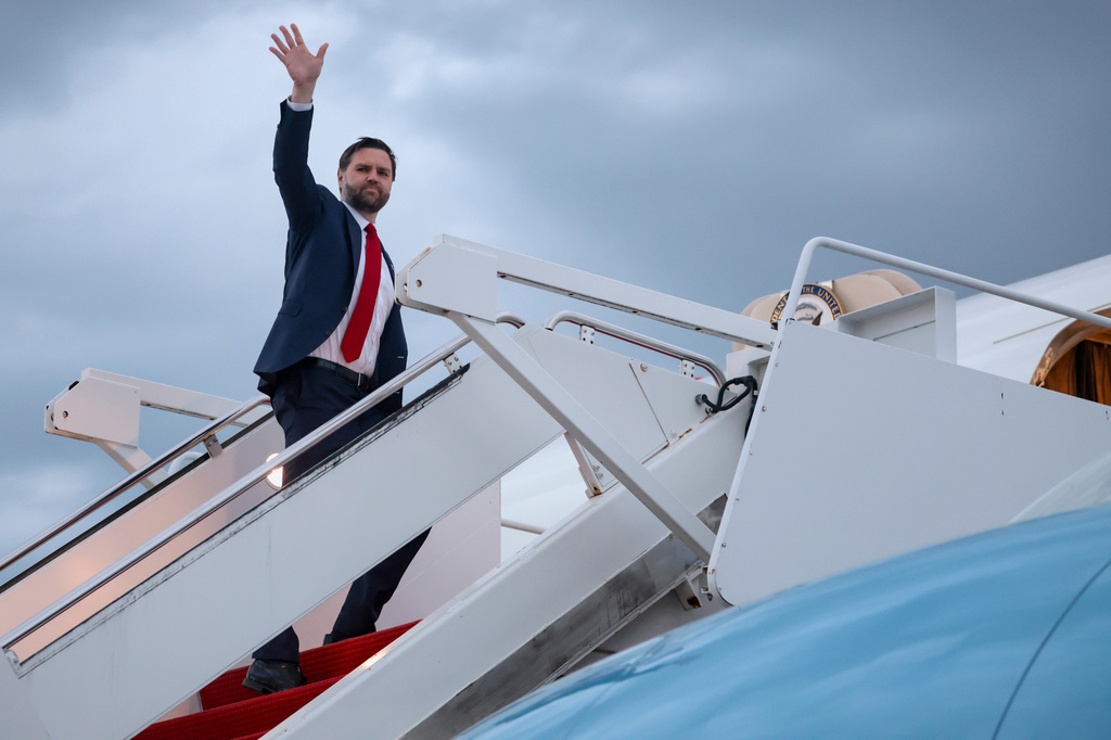 Vice President JD Vance waves as he boards Air Force Two to depart for Budapest, at Joint Base Andrews, Md., Monday, April 6, 2026. (Jonathan Ernst/Pool via AP)