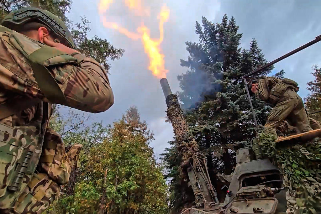 In this photo taken from video distributed by Russian Defense Ministry Press Service on Thursday, Oct. 23, 2025, the Russian 240mm "Tyulpan" mortar fires towards Ukrainian positions on an undisclosed location in Ukraine. (Russian Defense Ministry Press Service via AP)