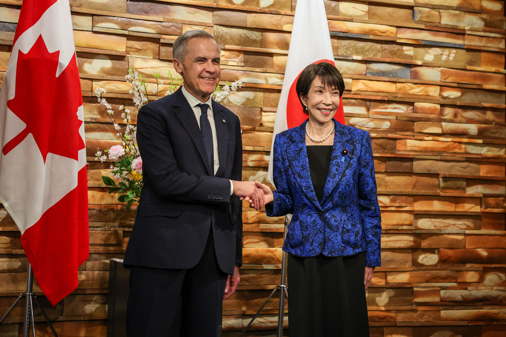 Canada's Prime Minister Mark Carney, left meets with Japan's Prime Minister Sanae Takaichi in Tokyo, Japan, Friday, March 6, 2026. (Takashi Aoyama/Pool Photo via AP)
