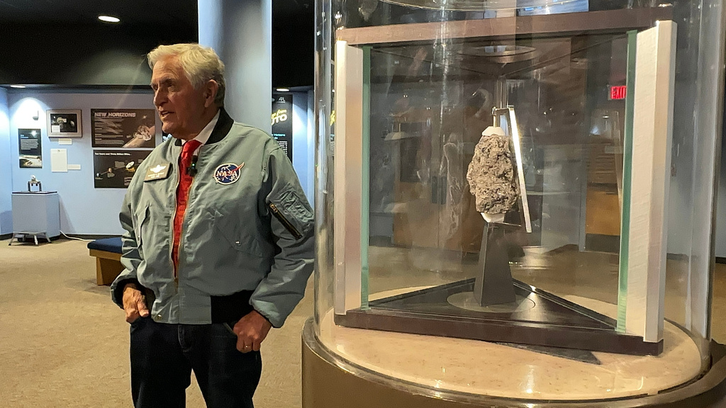 Apollo astronaut Harrison "Jack" Schmitt answers questions about his 1972 trip to the moon while standing near a moon rock on display at the New Mexico Museum of Natural History and Science in Albuquerque, N.M., on April 22, 2026. (AP Photo/Susan Montoya Bryan)