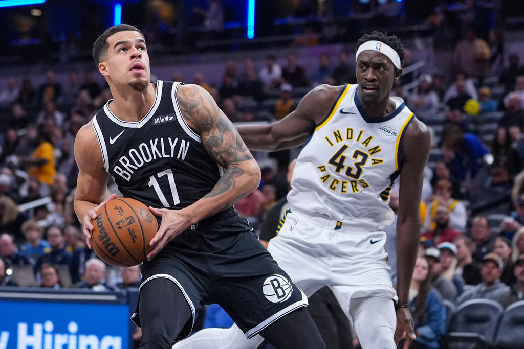 Brooklyn Nets forward Michael Porter Jr. (17) looks to shoot on Indiana Pacers forward Pascal Siakam (43) during the first half of an NBA basketball game in Indianapolis, Wednesday, Nov. 5, 2025. (AP Photo/Michael Conroy)