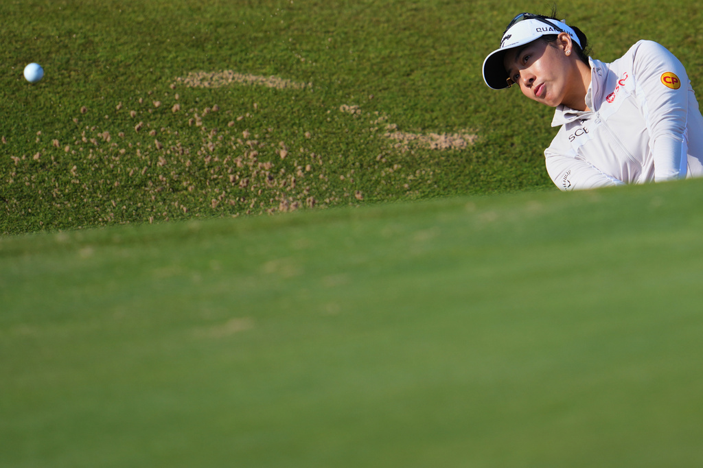 Jeeno Thitikul, of Thailand, plays a shot out of a bunker on the 3rd hole during the second round of the Women's British Open golf championship in Lytham St Annes, England, Friday, July 31, 2026. (AP Photo/Jon Super)