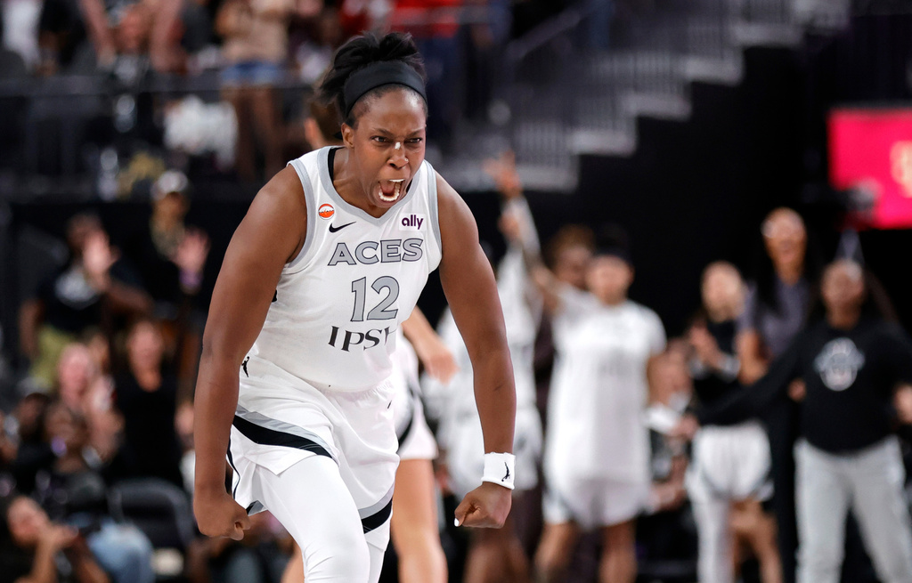 Las Vegas Aces guard Chelsea Gray (12) reacts after making a basket to send the game into overtime during the second half of an WNBA basketball game against the Chicago Sky Friday, July 3, 2026, in Las Vegas. (Steve Marcus/Las Vegas Sun via AP)