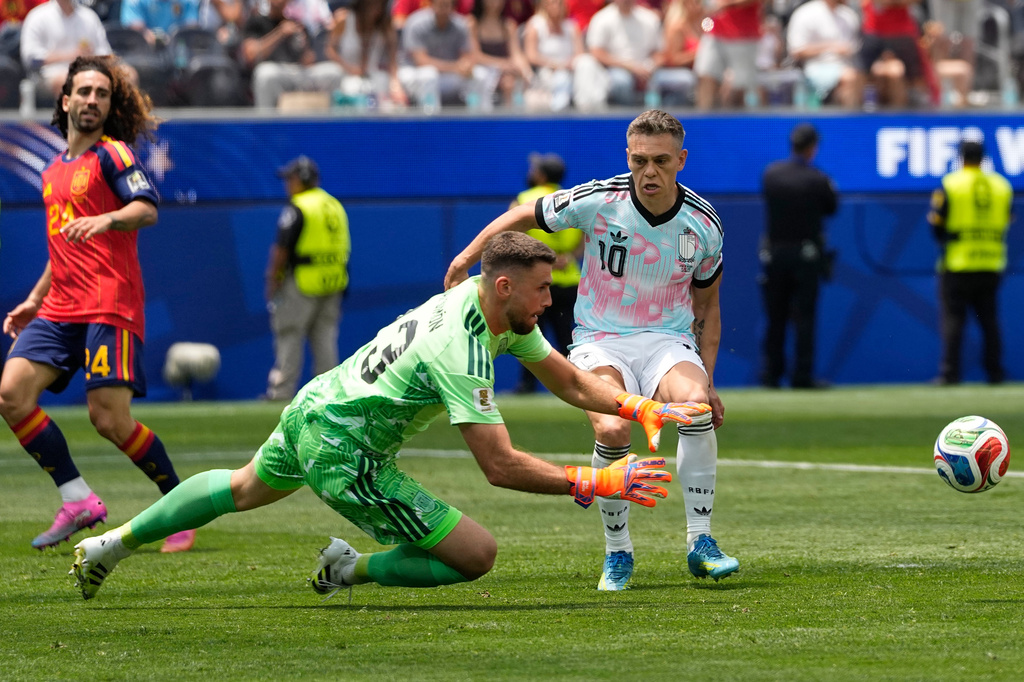 Spain goalkeeper Unai Simon (23) reaches for the ball to make a save during the World Cup quarterfinal soccer match between Spain and Belgium in Inglewood, Calif., near Los Angeles, Friday, July 10, 2026. (AP Photo/Lindsey Wasson)