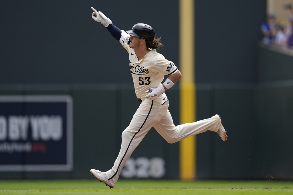 Minnesota Twins' Ryan Fitzgerald (53) runs the bases after hitting a 2-run home run as his first career hit during the third inning of a baseball game against the Kansas City Royals Sunday, Aug. 10, 2025, in Minneapolis. (AP Photo/Abbie Parr)