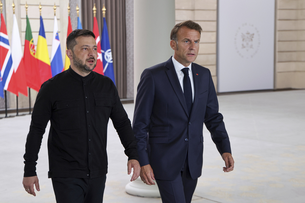Ukraine's President Volodymyr Zelenskyy, left, and French President Emmanuel Macron, arrive to attend a summit on Ukraine at the Elysee Palace, in Paris, France, Thursday, Sept. 4, 2025. (Ludovic Marin/Pool Photo via AP)