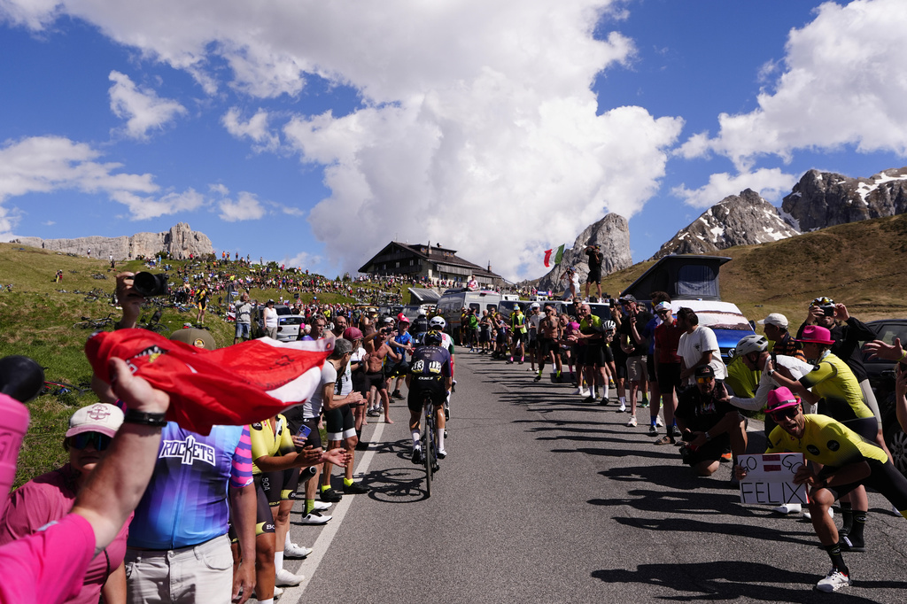 Riders pedal during the 19th stage of the Giro d'Italia cycling race, from Feltre to Alleghe, Italy, Friday, May 29, 2026. (Fabio Ferrari/LaPresse via AP)