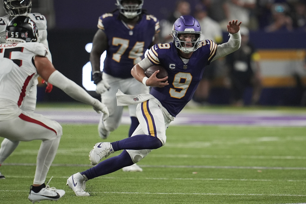 Minnesota Vikings quarterback J.J. McCarthy (9) runs the ball during the second half of an NFL football game against the Atlanta Falcons, Sunday, Sept. 14, 2025, in Minneapolis. (AP Photo/Mike Stewart)