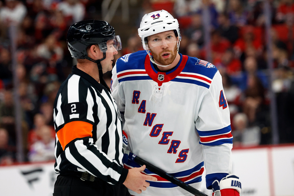 New York Rangers' Vladislav Gavrikov gets an explanation from an official during the second period of an NHL hockey game against the Carolina Hurricanes in Raleigh, N.C., Wednesday, Nov. 26, 2025. (AP Photo/Karl DeBlaker)