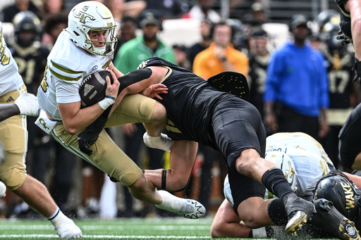 Georgia Tech quarterback Haynes King (10) is tackled by Wake Forest defensive lineman Gabe Kirschke (10) during the second half of an NCAA college football game, Saturday, Sept. 27, 2025, in Winston-Salem, N.C. (AP Photo/Matt Kelley) Georgia Tech quarterback Haynes King (10) is tackled by Wake Forest defensive lineman Gabe Kirschke (10) during the second half of an NCAA college football game, Saturday, Sept. 27, 2025, in Winston-Salem, N.C. (AP Photo/Matt Kelley)